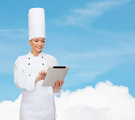 Image showing smiling female chef with tablet pc computer