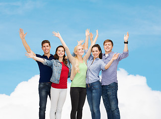 Image showing group of smiling students waving hands