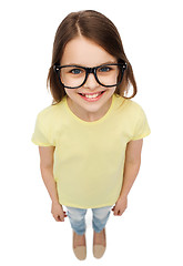 Image showing smiling cute little girl in black eyeglasses