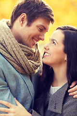 Image showing romantic couple kissing in the autumn park