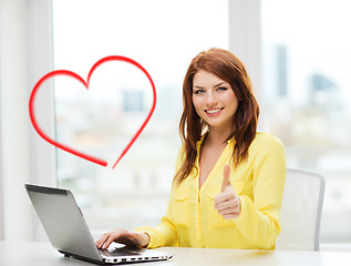 Image showing smiling student with laptop computer at school