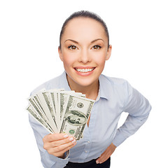 Image showing smiling businesswoman with dollar cash money