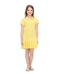 Image showing smiling little girl in yellow dress