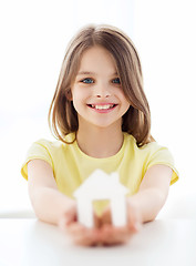 Image showing little girl holding white paper house