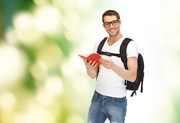 Image showing travelling student with backpack and book