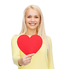 Image showing smiling woman with red heart