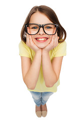 Image showing smiling cute little girl in black eyeglasses