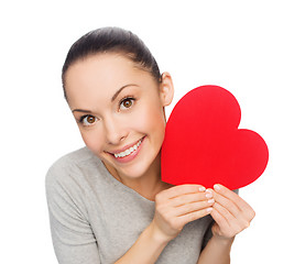 Image showing smiling asian woman with red heart