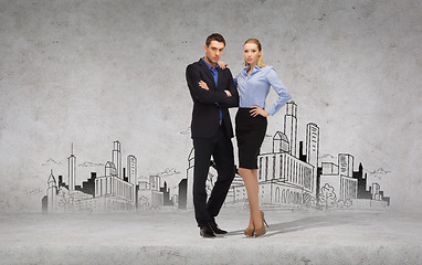 Image showing serious businessman and businesswoman