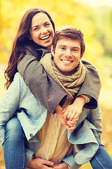 Image showing romantic couple playing in the autumn park