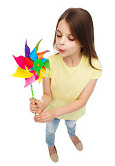 Image showing smiling child with colorful windmill toy