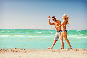 Image showing couple walking on the beach