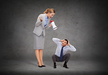 Image showing angry businesswoman with megaphone