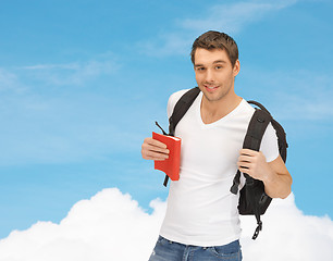 Image showing travelling student with backpack and book