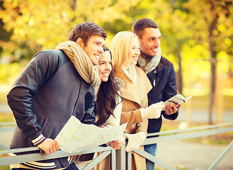 Image showing couples with tourist map in autumn park