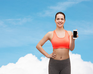 Image showing sporty woman with smartphone