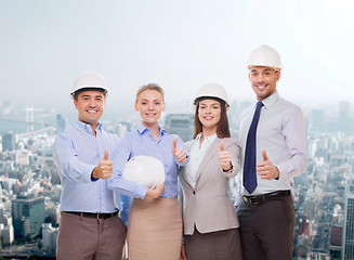 Image showing happy business team in office showing thumbs up