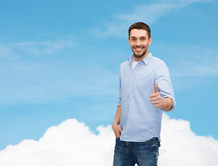 Image showing smiling man showing thumbs up