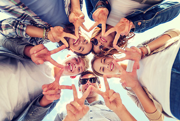 Image showing group of teenagers showing finger five