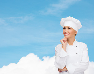 Image showing smiling female chef dreaming