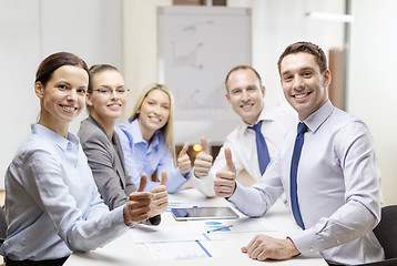 Image showing business team showing thumbs up in office