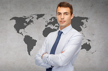Image showing friendly young businessman with crossed arms