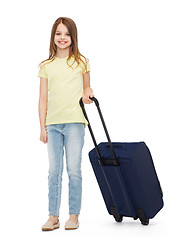 Image showing smiling little girl with suitcase