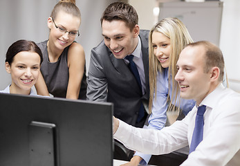 Image showing business team with monitor having discussion