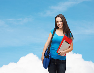 Image showing smiling student with bag, folders and tablet pc