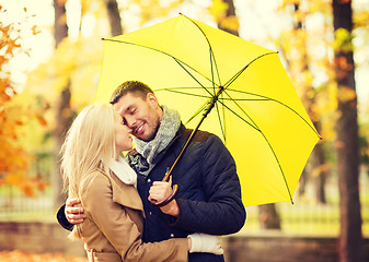 Image showing romantic couple kissing in the autumn park