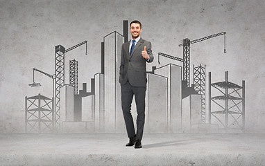 Image showing handsome businessman showing thumbs up