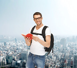 Image showing travelling student with backpack and book