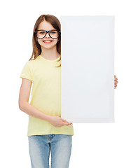 Image showing little girl wearing eyeglasses with blank board