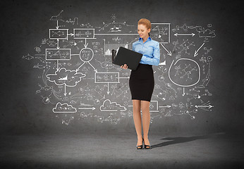 Image showing smiling businesswoman with folder