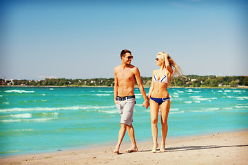 Image showing couple walking on the beach
