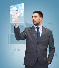 Image showing young businessman with smartphone