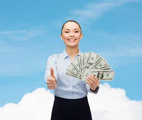 Image showing young businesswoman with dollar cash money