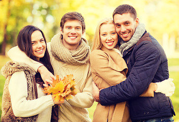 Image showing group of friends having fun in autumn park
