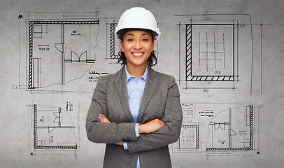 Image showing businesswoman in white helmet with crossed arms