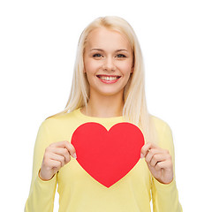 Image showing smiling woman with red heart