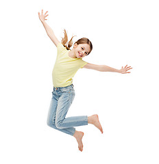 Image showing smiling little girl jumping