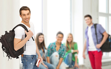 Image showing travelling student with backpack and book