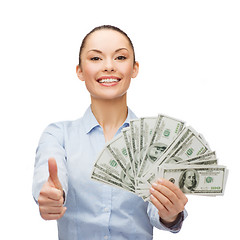 Image showing young businesswoman with dollar cash money