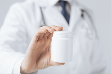 Image showing doctor hands holding white pack