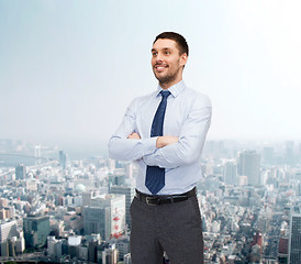 Image showing handsome businessman with crossed arms