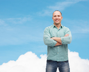 Image showing smiling man with crossed arms