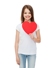 Image showing smiling little girl with red heart