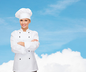 Image showing smiling female chef with crossed arms