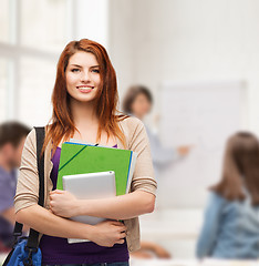 Image showing smiling student with bag, folders and tablet pc