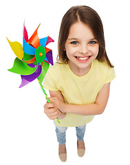 Image showing smiling child with colorful windmill toy